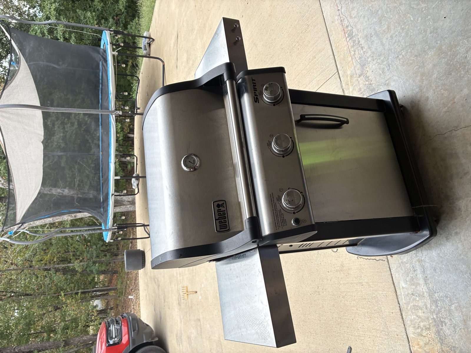 Weber Spirit natural gas grill with stainless lid and cover